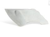 a white sculpture of a wave on a white surface