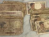 some old money sitting on top of a table next to each other