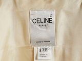the label on the back of a dress shows that it is made in france