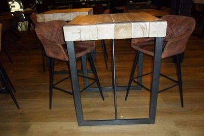 tables and chairs in a restaurant with a wooden table and brown chairs