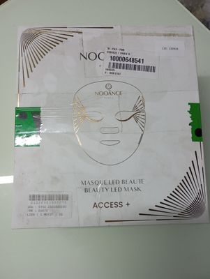a box with a mask on top of it on a table