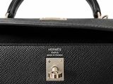 the black leather briefcase is open and ready to be used