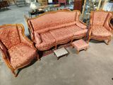 three couches and a chair in a room