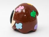 a brown pig with colorful flowers on it ' s head