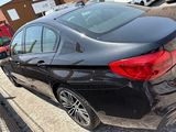a black car that is parked in a parking lot