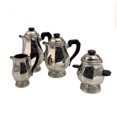 three silver teapots and a coffee pot on a white background