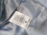 the label on the jacket is attached to the collar of the jacket