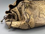 an image of a snake skin purse on a table