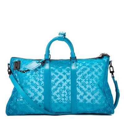 a large blue bag sitting on top of a white surface
