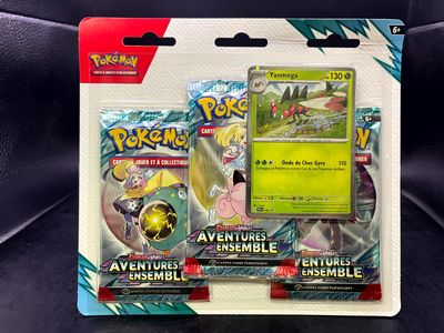 two pokemon trading cards are on display on a black surface