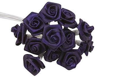 a bunch of purple roses that are on a white headband