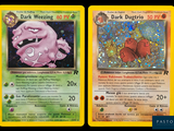 two pokemon cards with different designs on them on a black background