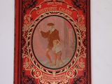 un vieux livre rouge sur lequel figure l'image d'un homme et d'une femme