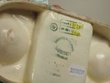 a close up of a container with eggs inside of it