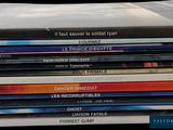a lot of dvds stacked on top of each other