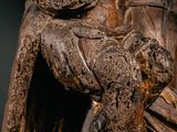 a statue of a man holding a baby in his arms