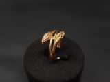a gold ring sitting on top of a black box