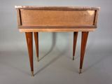 an image of a small wooden table with a drawer on it