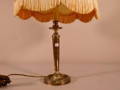 a lamp that is sitting on a table next to a lamp