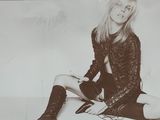 a black and white photo of a woman sitting on the floor