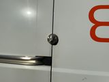 a white van with a red b on the door