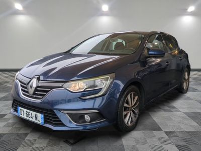 a blue car parked in a garage with a checkered floor