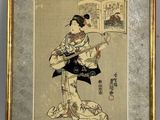 an old picture of a woman reading a book in front of a wall