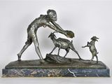 bronze statue of a woman and two dogs on a marble base