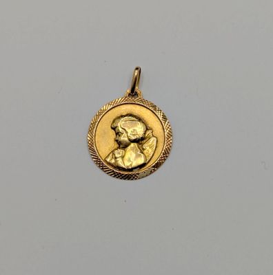 une pièce d'or portant le portrait d'un homme