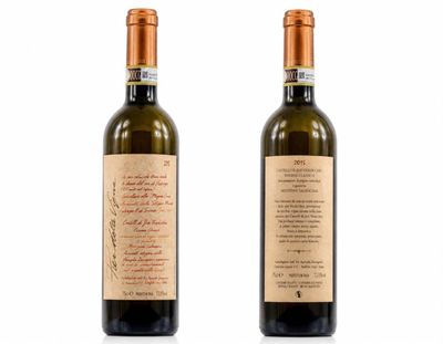 two bottles of wine are shown on a white surface