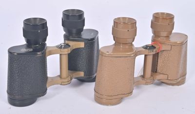 several different types of binoculars are lined up on a white surface