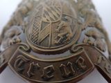 a close up of a badge on a white surface