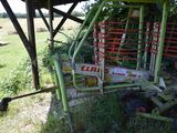 a tractor that is parked next to a fence
