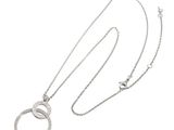 an image of a silver necklace with two rings on a chain