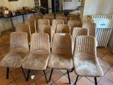 many chairs that are lined up in a room