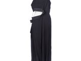 a black dress on a mannequin stand on a white background