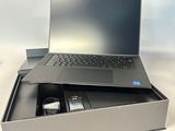 a laptop computer sitting in a box on a table