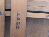 a close up of a wooden shelf with a clock on it