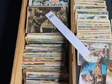 a box full of cards and a ruler on a table