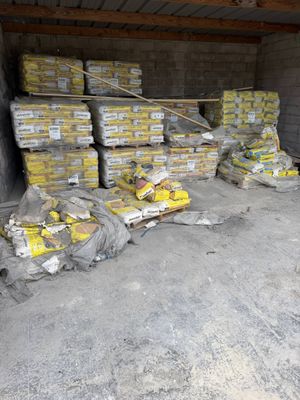 many bags of food sitting in a storage area