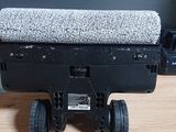 a small toy truck with wheels on a wooden table