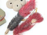 three stuffed animals that are laying on a white surface