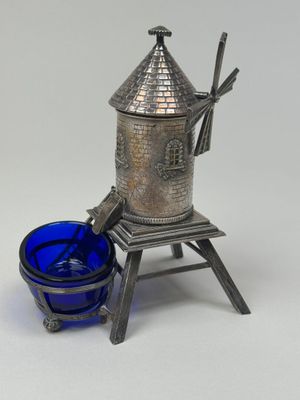 an image of a silver and blue glass candle holder and a blue glass cup