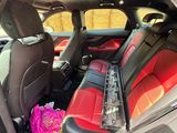 a car with a bunch of flowers in the back seat