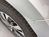 a close up of a car ' s tire on a snowy surface