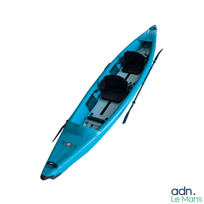 a blue kayak sitting on top of a white surface