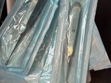 a lot of toothbrushes that are wrapped in plastic bags