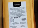 the back of a box with a package inside of it