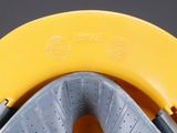 a close up view of a yellow and gray plastic bowl