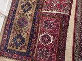two rugs that are on the floor next to each other